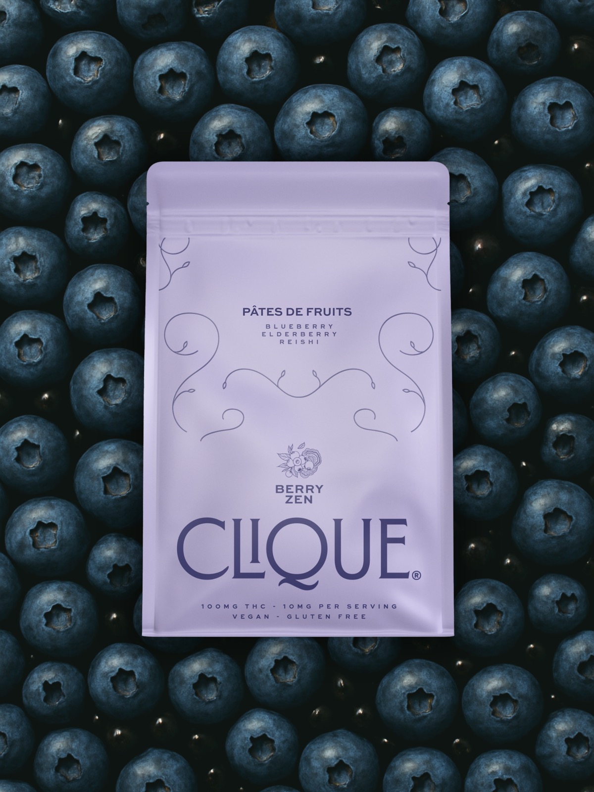Clique Berry Zen package resting on a bed of fresh blueberries